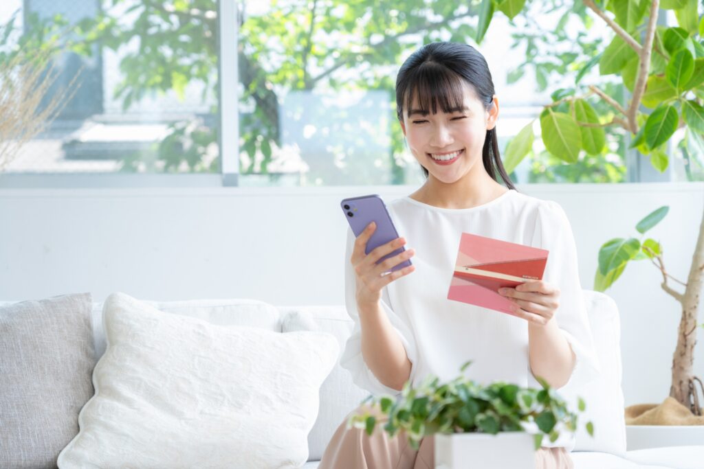 smiling girl with phone and tuutyou