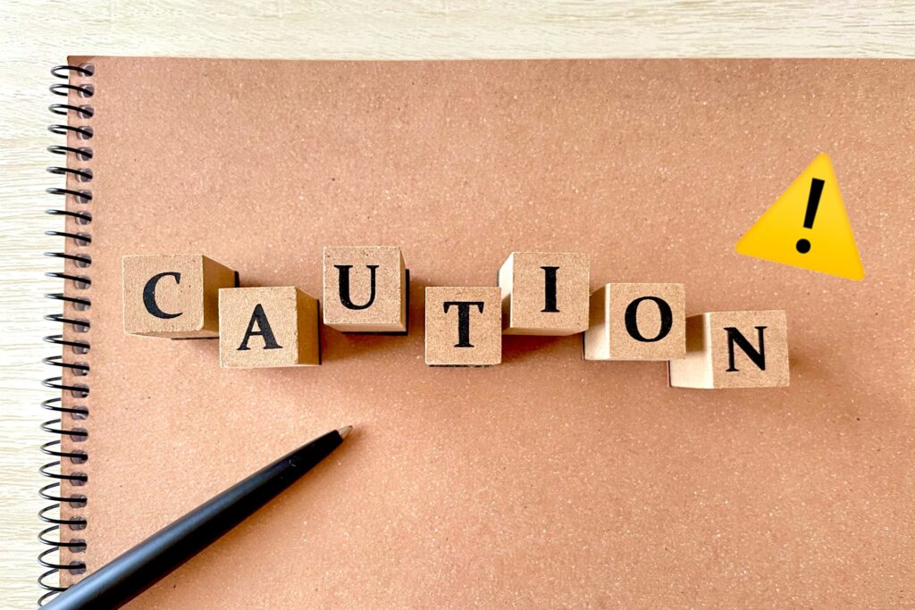 caution triangle text