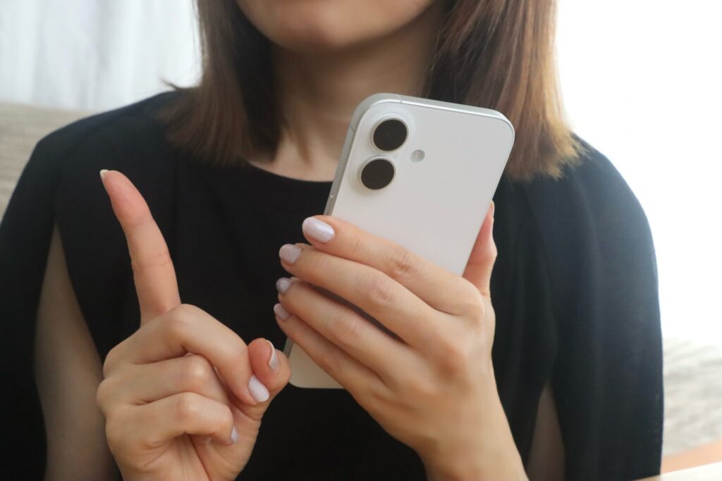 pointer finger phone in hand