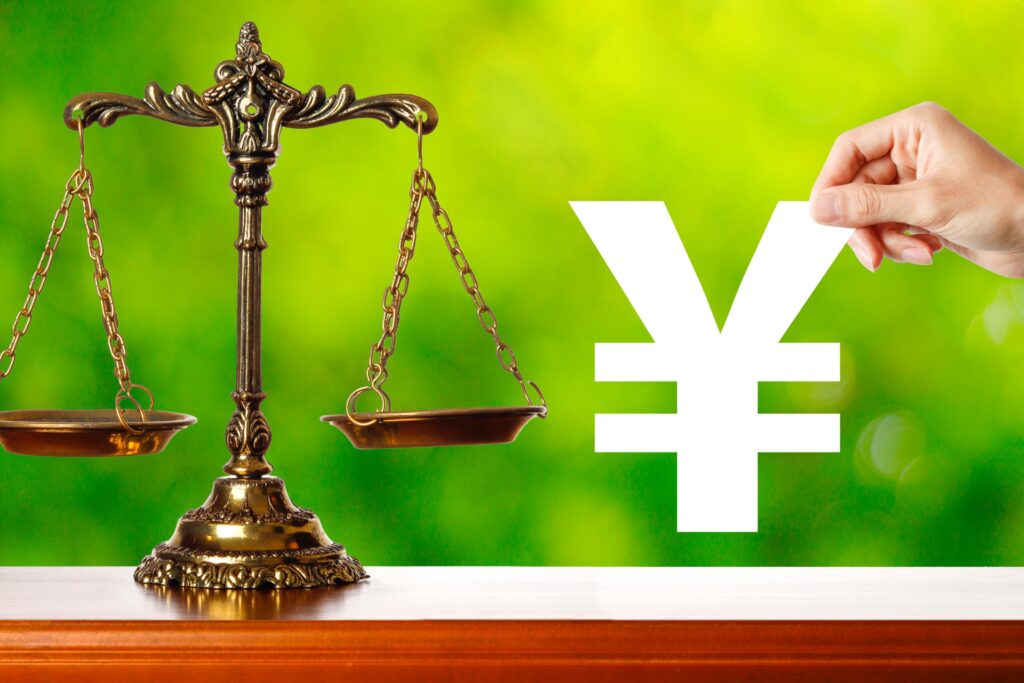 天秤と¥のマーク